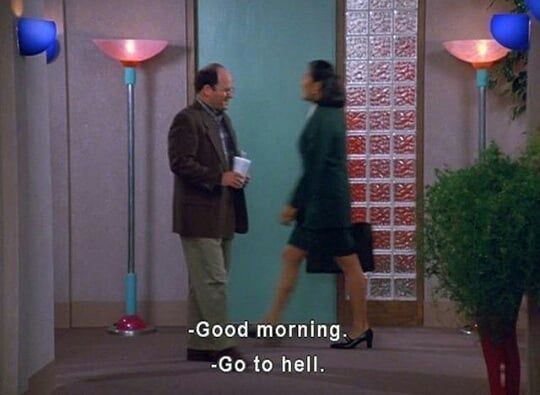 a man and woman standing in front of a door with the words good morning go to hell