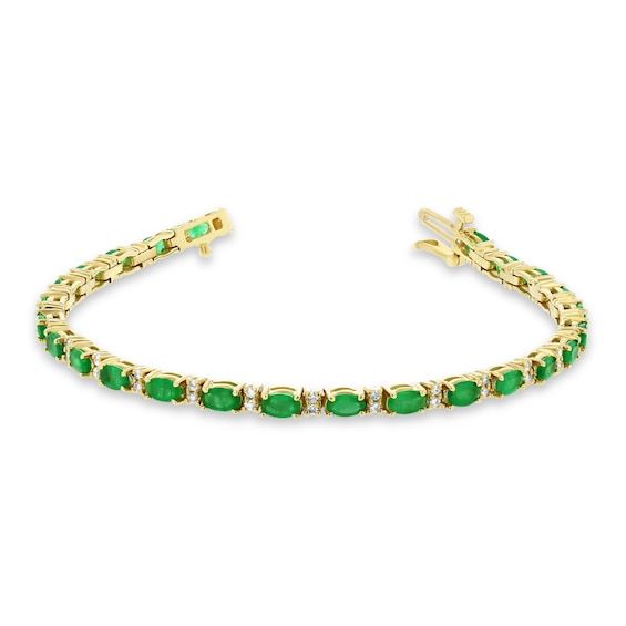 Add a pop of color to all your favorite looks with this charming oval-shaped green emerald and diamond alternating line bracelet in yellow gold. Fashioned in 14K gold This design glistens with sideways 5.0 x 3.0mm oval-shaped verdant-green emeralds. Pairs of petite diamonds shimmer between, completing the alternating pattern. This choice sparkles with 1/2 ct. t.w. of diamonds. The 7.0-inch bracelet secures with a box clasp. Elegant Green Oval Diamond Bracelet, Classic Green Oval Diamond Bracelet, Luxury Green Oval Tennis Bracelet, Green Oval Diamond Bracelet For Anniversary, Green Oval Diamond Bracelet For Gift, Green Oval Diamond Bracelet Gift, Classic Green Oval Tennis Bracelet, Fine Jewelry Green Oval Bracelets, Oval Green Bracelets Fine Jewelry