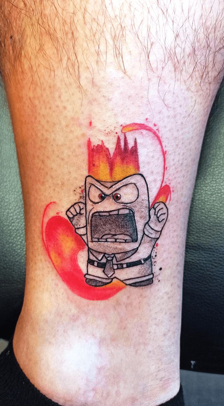 a man's foot with a cartoon character drawn on it and fire coming out of the oven