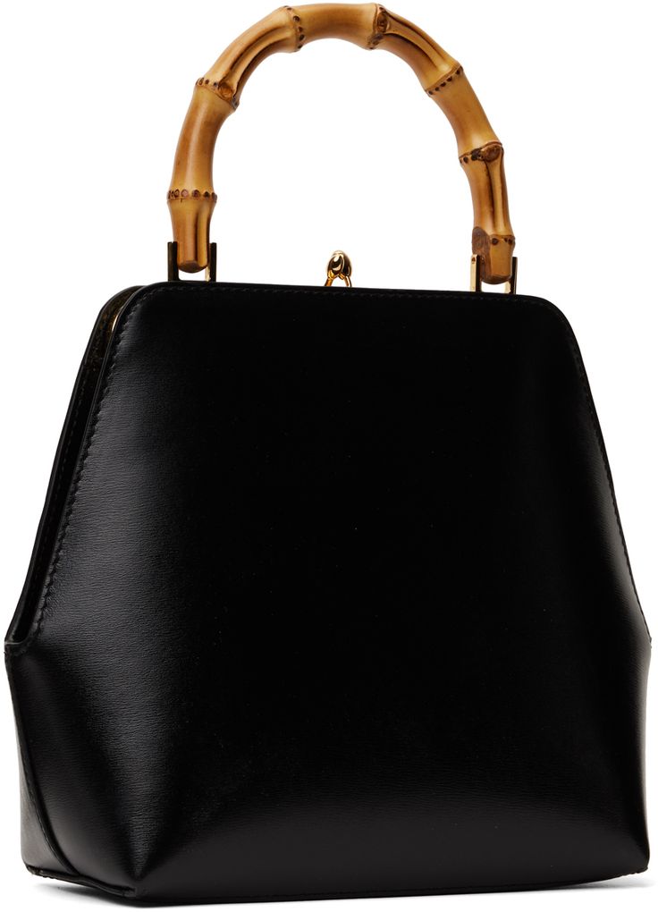 Grained calfskin top handle bag in black. · Bamboo carry handle · Logo stamp at face · Kiss-lock closure · Zip pocket at interior · Nappa calfskin lining · H7.75 x W7.25 x D3 Supplier color: Black Black Shoulder Bag With Bamboo Round Handle, Classic Bags With Leather Lining And Round Handle, Formal Black Shoulder Bag With Bamboo Handle, Evening Leather Shoulder Bag With Bamboo Handle, Leather Shoulder Bag With Bamboo Handle For Evening, Black Bags With Bamboo And Double Handle, Black Bags With Bamboo Double Handle, Modern Black Shoulder Bag With Bamboo Handle, Black Bags With Bamboo Handle And Double Handle