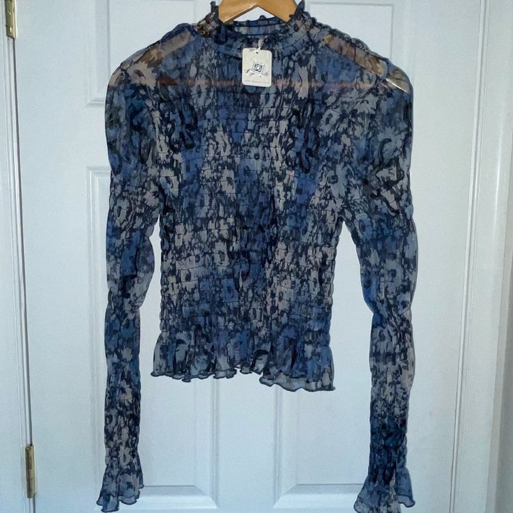 Super Cute And Sheer Free People Ruched Blouse. Flouncy Sleeves Are Long To Be Pushed Up And Create A Little Bit Of Puffed Sleeves. Perfect With A Black Or Navy Camisole Underneath. 100% Polyester, Machine Washable, Tumble Dry. I'm Usually A Small Or X-Small And It Fits Me Fine. Blue Ruched Long Sleeve Top, Blue Long Sleeve Ruched Top, Blue Ruched Long Sleeve Blouse, Long Sleeve Blue Ruched Blouse, Elegant Ruched Blue Tops, Elegant Blue Ruched Tops, Chic Blue Smocked Top For Fall, Blue Fitted Smocked Top For Fall, Chic Blue Long Sleeve Smocked Top