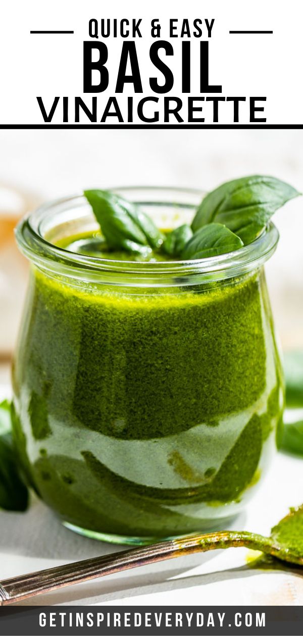 a jar filled with pesto and basil