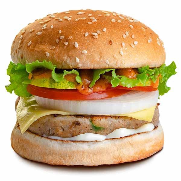 a large hamburger with lettuce, tomato and cheese on it's bun