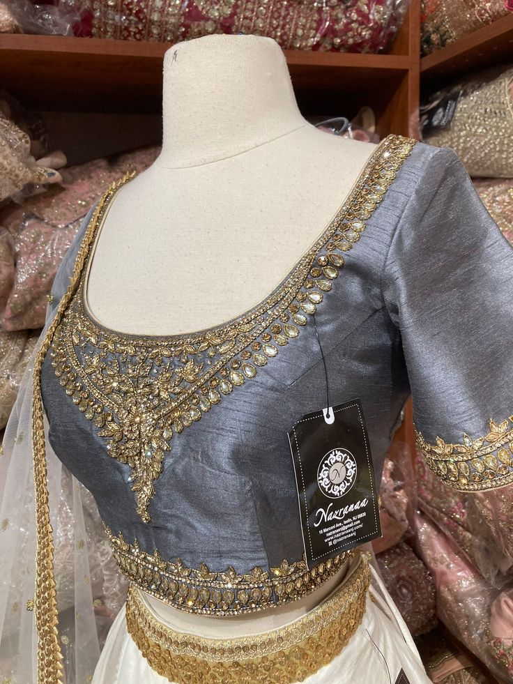 Jasmine white plain lehenga with gold border teamed with contrasting grey intricate in kundan, cut dana and stone work blouse and net dupatta. Fabric: Silk Occasion: Wedding Ceremony or Reception. WASH CARE INSTRUCTIONS - Please Dry clean only when it is applicable. Slight color variation is possible due to digital photography. This outfit can be customized in multiple colors and specific to client measurements. 120 days of production time is required and are for bulk orders only!Order are proce Bridesmaids Lehenga, Plain Lehenga, Stone Work Blouse, Jasmine White, Bridesmaid Lehenga, White Bridesmaid, White Plains, Gold Border, Net Dupatta