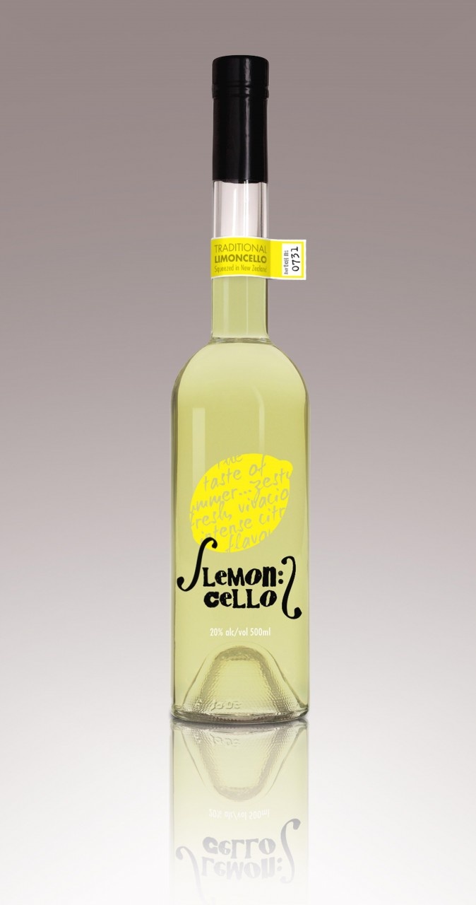 a bottle of lemon syrup on a reflective surface