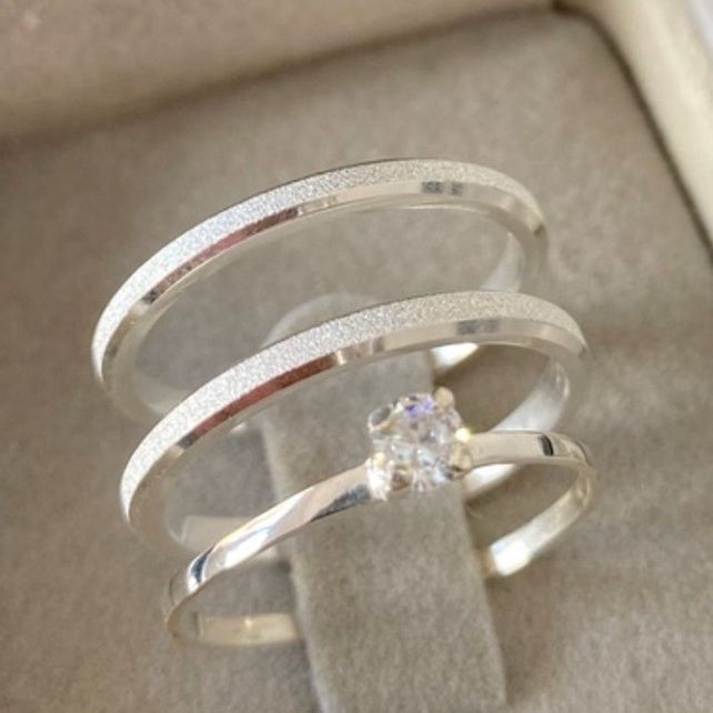 a ring with a diamond on it sitting in a box