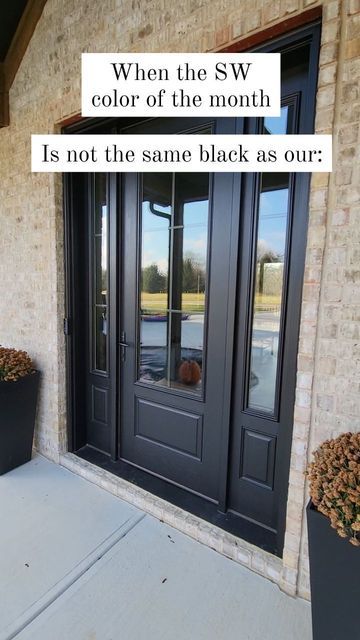 a black front door with the words when the sw color of the month is not the same black as our