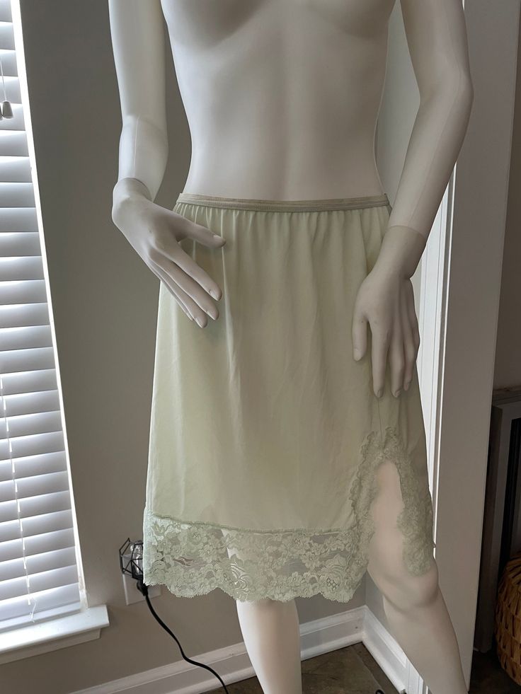 Vanity Fair  Slip Skirt  1950's  Mint green color and sz M  1950's Due to the item being vintage small flaws are to be expected.  PLEASE USE CODE 20SALE FOR 20% OFF YOUR FIRST PURCHASE Spring Green Bottoms With Lace Trim, Summer Green Skirt With Lace Trim, Green Lined Skirt For Daywear, Elegant Short Green Skirt, Green Stretch Bottoms With Lace Trim, Vintage Stretch Green Bottoms, Fitted Green Petticoat For Summer, Fitted Green Petticoat For Spring, Vintage Green Skirt For Spring