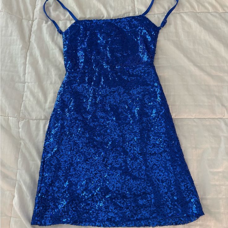 Back Is Open All Sequenced Super Cute Never Worn Fitted Royal Blue Mini Dress For Prom, Blue Sleeveless Sequin Dress For Homecoming, Blue Sleeveless Mini Dress For Prom, Blue Fitted Sequin Mini Dress, Blue Sequin Prom Dress For Summer, Fitted Blue Sequin Mini Dress, Blue Fitted Mini Sequin Dress, Blue Sequin Dress For Summer Night Out, Blue Sequin Dress For Night Out In Summer