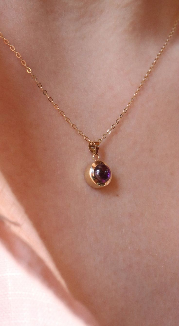 Indulge in timeless elegance with our 14K Gold Amethyst Necklace. This exquisite piece showcases a stunning amethyst gemstone, known for its rich purple hues and captivating brilliance. Crafted from high-quality 14K gold, the necklace features a delicate chain, perfectly complementing the vibrant amethyst pendant. The amethyst gemstone is believed to possess healing properties and symbolize inner strength and balance. Wear this necklace as a personal talisman or gift it to a loved one to convey Elegant Amethyst Round Pendant Jewelry, 14k Gold Birthstone Necklace With Gemstone For Formal Occasions, Formal 14k Gold Birthstone Necklace With Gemstone, Formal 14k Gold Birthstone Necklace, Elegant Purple Round Pendant Necklace, Dainty Gemstone Birthstone Necklace For Formal Occasions, Formal Birthstone Necklace With 17 Jewels In Round Pendant, Elegant 14k Gold Birthstone Necklace With Briolette Shape, Formal Dainty Birthstone Necklace With Gemstones