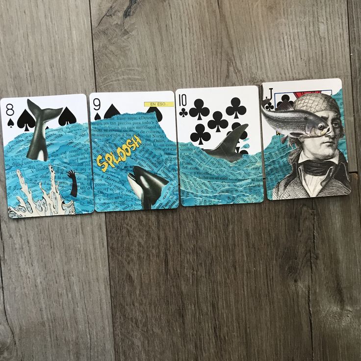 four playing cards with an image of a man in the ocean and dolphins on them