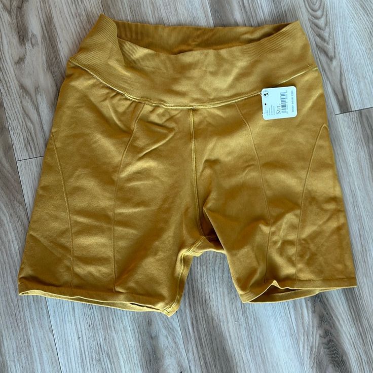 Never Worn, W Tags. Mustard Color Yellow Stretch Biker Shorts, Yellow Biker Shorts For Workout With Built-in Shorts, Yellow Biker Shorts For Workout, Yellow Stretch Yoga Shorts, Cotton Biker Shorts For Gym, Yellow Biker Shorts For Sports, Yellow Yoga Shorts, Yellow Stretch Athleisure Biker Shorts, Yellow Stretch Biker Shorts Athleisure Style