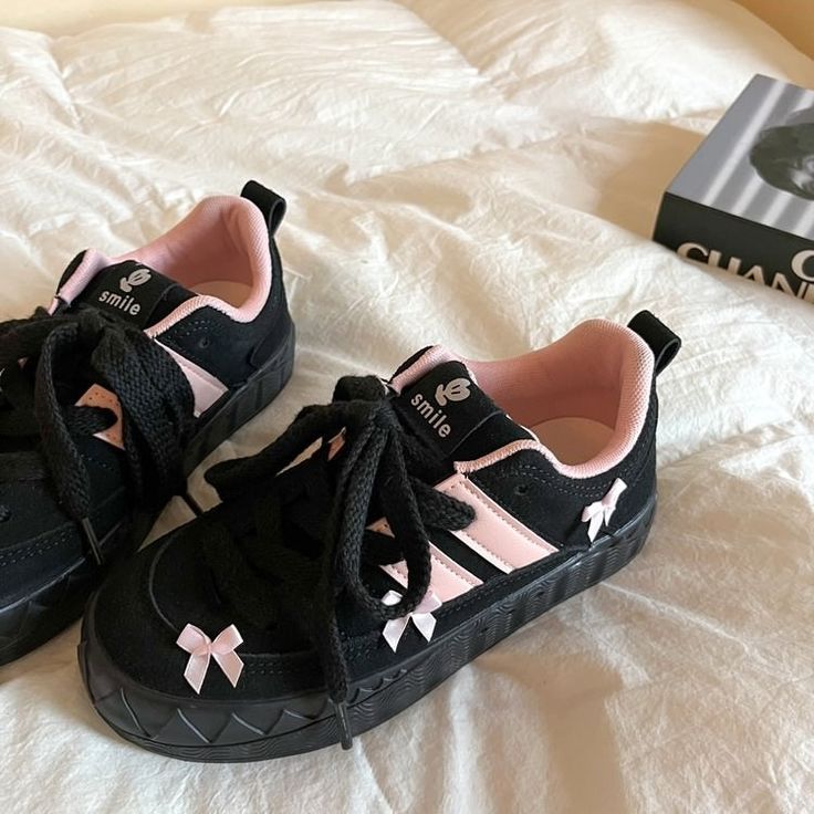 These Blokette Aesthetic Black and Pink Platform Sneakers feature a vegan leather upper with pink stripes, a low ankle rise, lace-up front, and cute pink bows all over. ✨Material: Vegan LeatherRun small, please review the sizing information Pink Harajuku Sneakers With Round Toe, Pink Harajuku Sneakers For Spring, Trendy Lace-up Skate Shoes For School, Pink Flat Heel Sneakers For Streetwear, Pink Lace-up Skate Shoes, Cute Pink Sneakers With Vulcanized Sole, Trendy Pink Skate Shoes With Laces, Trendy Pink Lace Skate Shoes, Cute Pink Sneakers For Streetwear