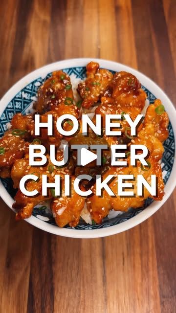 honey butter chicken in a bowl with the words honey butter chicken above it on a wooden table