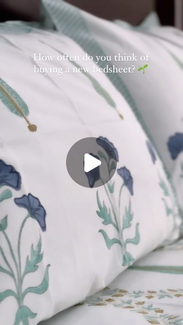 an image of a bed with blue flowers on it and the words how often do you think of buying a new bed sheet?