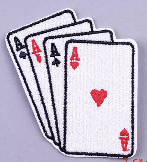 four playing cards with red hearts on them are embroidered onto the back of an iron - on patch