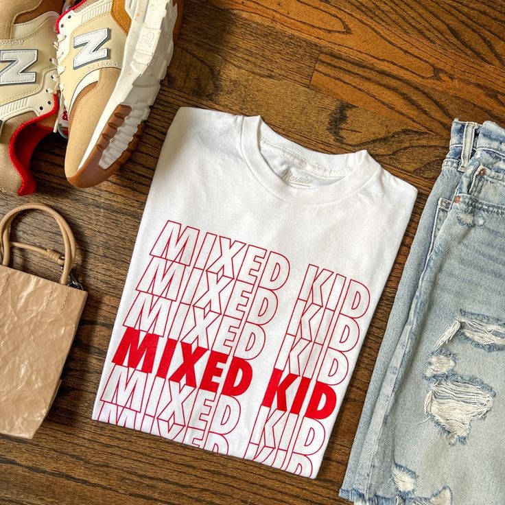 Unlock endless style possibilities with our 'Mixed Kid' shirt from mosaicthelabel.com! Embrace diversity and express your unique identity with this empowering statement piece. Pair it with denim jeans and sneakers for a casual-cool vibe or dress it up with a blazer for a trendy twist. Shop now and celebrate individuality in style! Statement Pieces, Kids Shirts, In Style, Apparel Accessories, Denim Jeans, Shop Now, Twist, Blazer, Sneakers