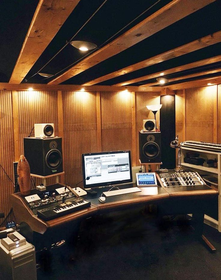 a recording studio with sound equipment and laptop