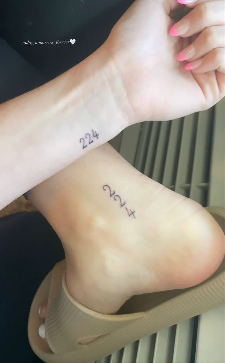 two people with tattoos on their feet and one has the word love written on it