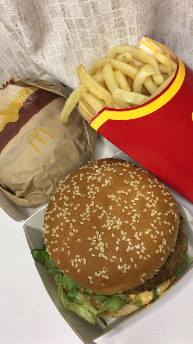 a hamburger and french fries are sitting on a table