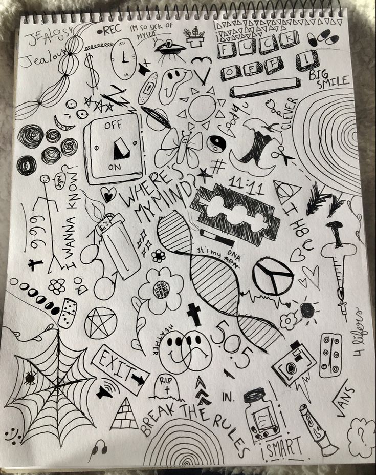 a notebook with doodles on it and various things in the background, all drawn by hand