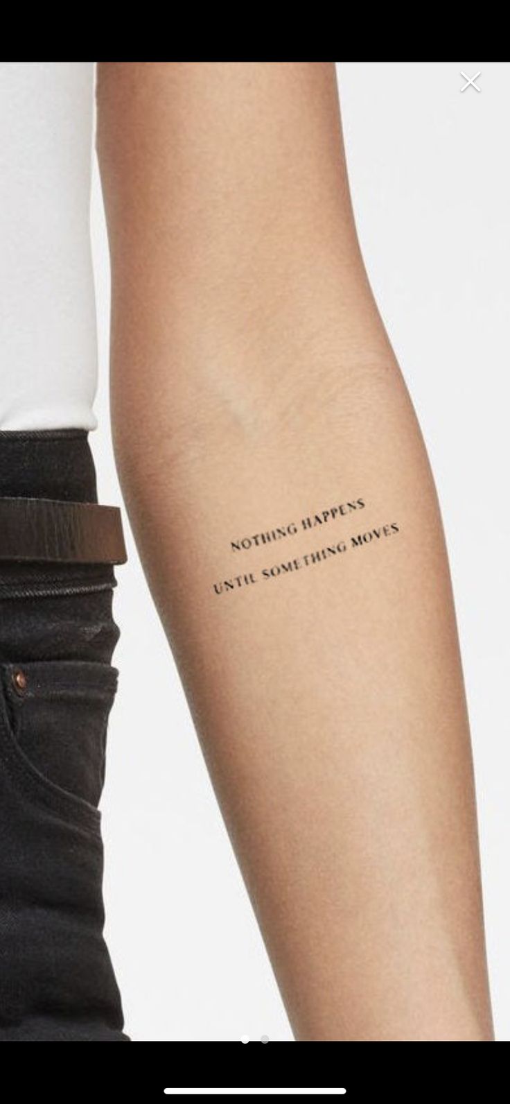 a woman's arm with a quote on it that says, nothing happens in the same