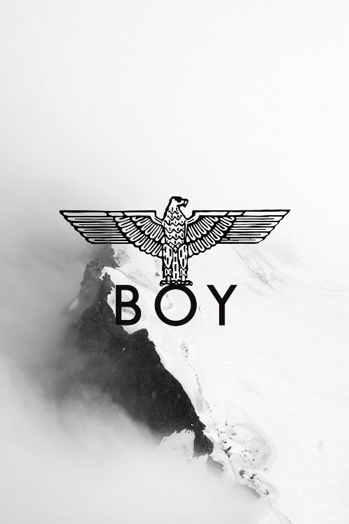 a black and white photo with the word boy on it in front of a snowy mountain