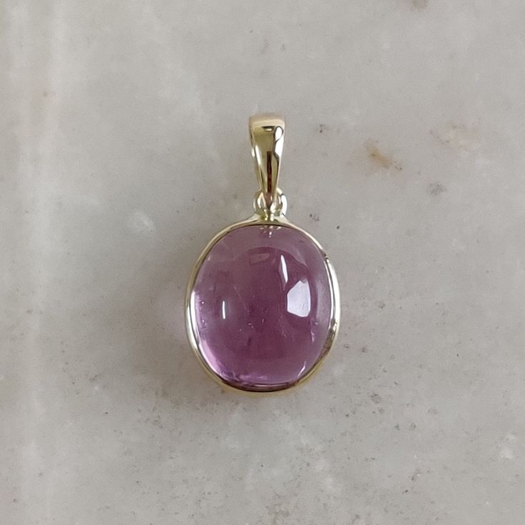 DESCRIPTION: This stunning Pendant is set in 14k Solid Yellow Gold with Natural Kunzite with utmost precision. It is a unique gemstone Pendant for nearly every occasion and is completely hassle-free jewelry. ITEM DETAILS: * CENTER GEM: Kunzite * GEM SIZE: 10X11mm * GEM SHAPE: Oval * Gem weight: 8.30 carats * Gold Purity: 14KT (58.33% approx.) * Gold Weight: 0.54 gram * Total Weight of the Pendant: 2.20 gram The Gold purity is guaranteed and it comes with authentic 14KT gold hallmark. Since my items are handmade, they are absolutely nickel and lead free. CUSTOMIZATION: * Gemstone customization is available and it can be substituted with a gem of your choice. Kindly message me for the same. PACKAGING * The Pendant comes with layers of safe and secure wrapping along with Free handmade jewelry Handmade Jewelry Box, Golden Rutilated Quartz, Personalized Pendant, Bezel Pendant, Birthstone Pendant, October Birthstone, Unique Gemstones, Oval Pendant, Rutilated Quartz