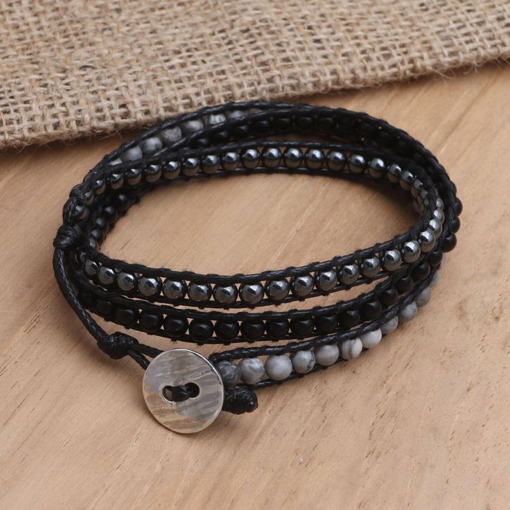 Designed with a monochromatic color scheme Ayu Widiani's wrap bracelet is a chic way to accessorize your outfit. Balinese artisans hand craft the bracelet from a trio of gems: Black onyx reflective hematite and mottled grey jasper beads. A durable cotton cord holds everything in place while a sterling silver button clasp adds shine. Gemstone Wrap Bracelet, Monochromatic Color Scheme, Silver Buttons, Jasper Beads, Jewelry Packaging, Pearl Pendant, Jewelry Gift Box, Metal Jewelry, Wrap Bracelet