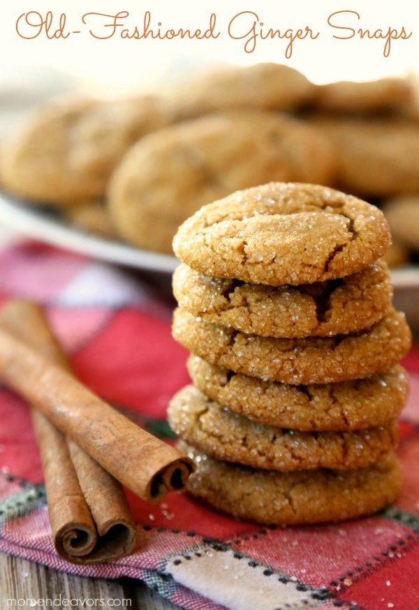 a stack of cookies with cinnamon sticks next to it