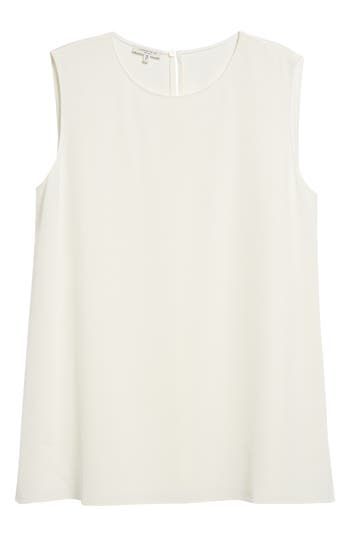 Whether worn as an underpinning or as a feature piece, this sleeveless blouse is all simple elegance in a straight cut from shape-retaining stretch silk. 28" length (size Medium) Back keyhole with button-and-loop closure Jewel neck Sleeveless Side slits 94% silk, 6% elastane Dry clean Imported Women's Designer Clothing White Sleeveless Viscose Top, Classic Sleeveless Top For Daywear, Classic White Sleeveless Blouse, Classic White Sleeveless Tank Top, Fitted Silk Tank Top For Work, Formal Silk Tank Top For Summer, Chic Viscose Sleeveless Tank Top, Chic Sleeveless Viscose Tank Top, Classic Sleeveless Tank Top For Daywear