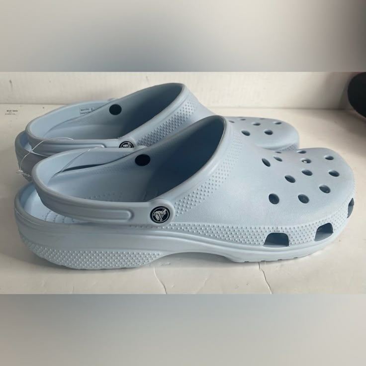 Nwt Crocs Men’s Classic Clogs Light Blue Size 17. Also Available In Size 15 And 16 Light Blue Crocks Shoes, Light Blue Platform Crocs, Casual Light Blue Slip-on Clogs, Light Blue Non-slip Slip-on Clogs, Casual Closed Toe Clogs With Branded Insole, Casual Slip-resistant Flat Clogs, Casual Light Blue Clogs For Summer, Casual Light Blue Summer Clogs, Blue Slip-resistant Synthetic Clogs