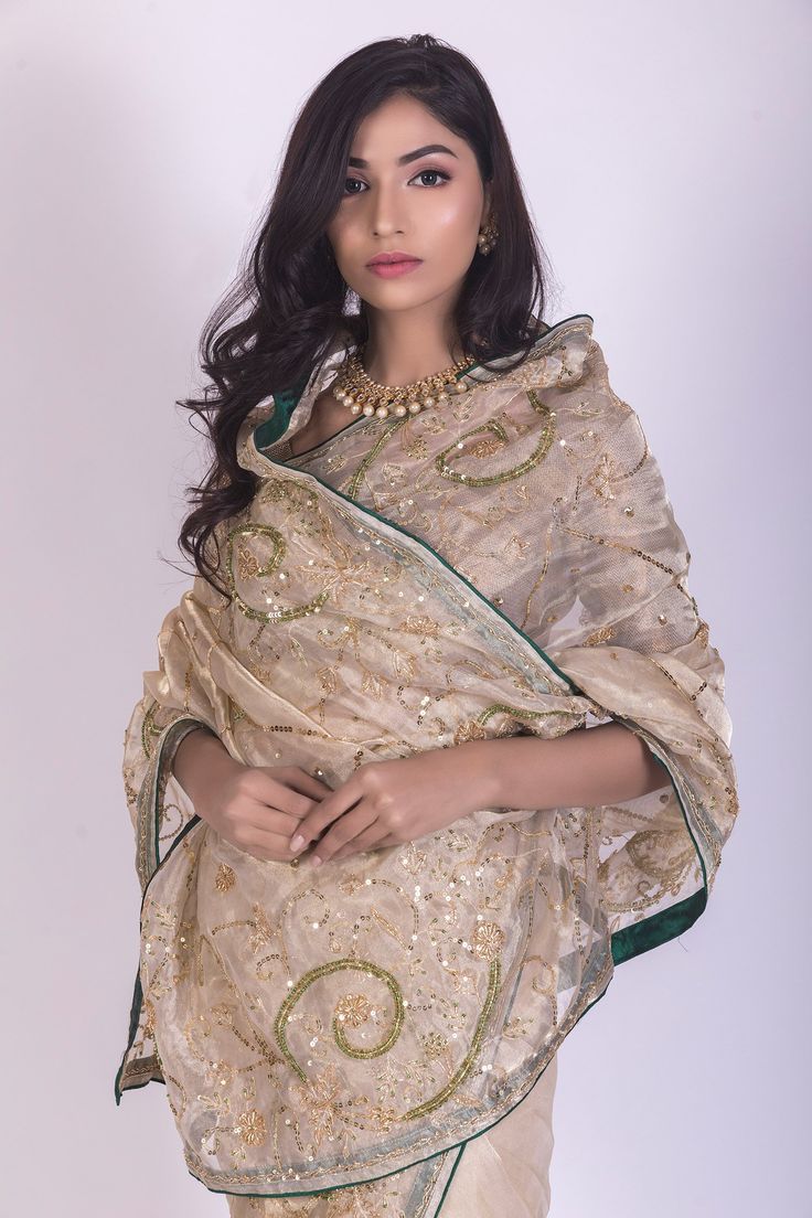 Beige tissue saree with intricate zardosi, sequins and aari handwork embroidery. Comes with blouse.
Components:2
Embroidered
Fabric:Tissue, Crepe
Color:Gold, Beige
Handwork embroidery - Aza Fashions Gold Organza Pre-draped Saree With Resham Embroidery, Festive Bollywood Pre-draped Tussar Silk Saree, Festival Organza Pre-draped Saree With Mirror Work, Traditional Drape Salwar Kameez With Dupatta For Reception, Eid Designer Wear Embroidered Tissue Silk Fabric, Eid Embroidered Tissue Silk Fabric For Designer Wear, Embroidered Tissue Silk Fabric For Designer Wear At Eid, Bollywood Style Embroidered Chanderi Pre-draped Saree, Raw Silk Salwar Kameez With Dupatta For Reception