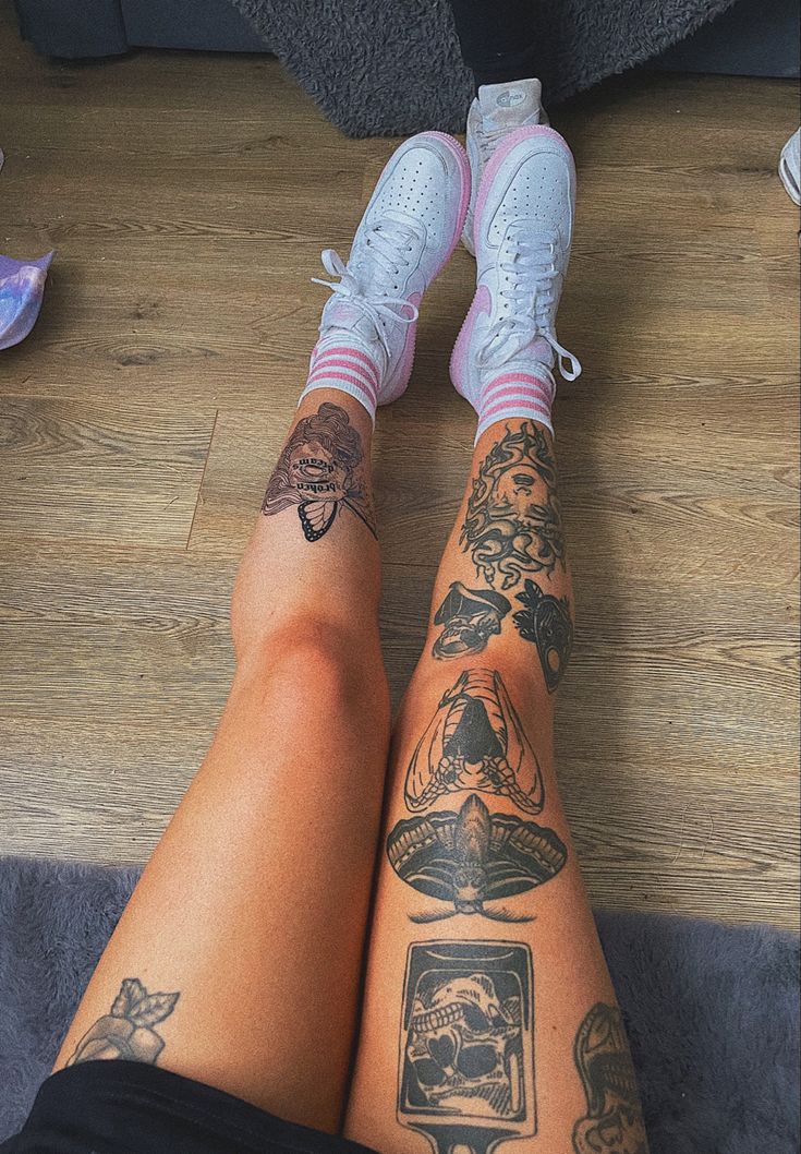 the legs of a person with tattoos on them