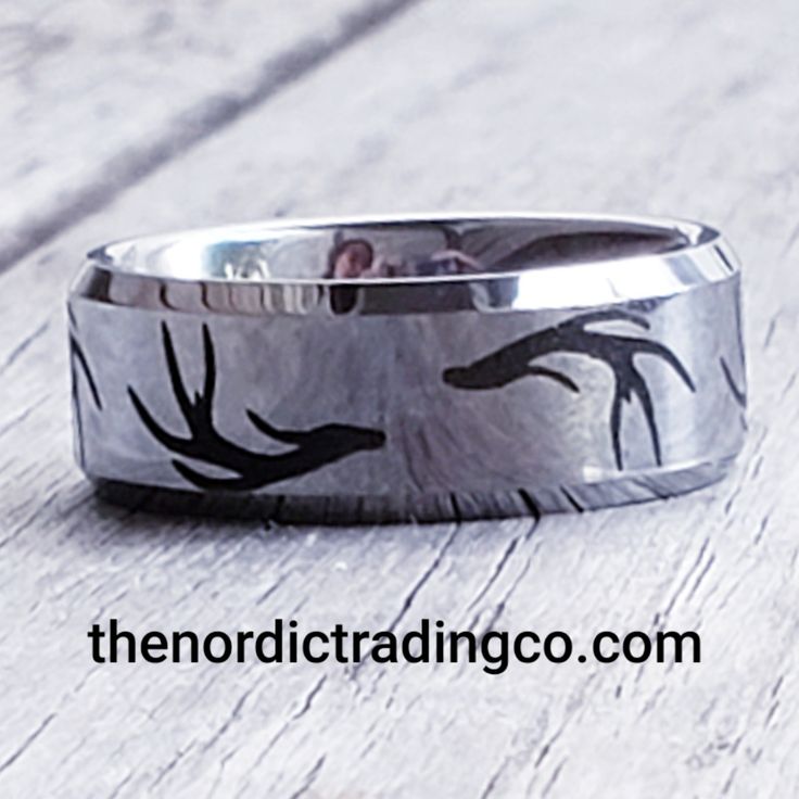 a wedding ring with birds painted on it