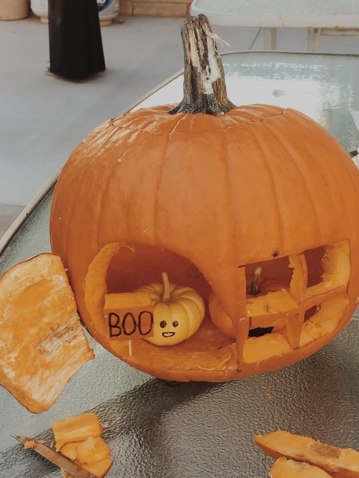 a pumpkin with the word boo carved into it