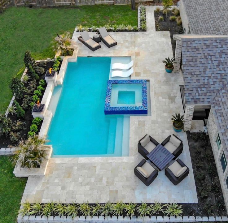 an aerial view of a pool and patio area