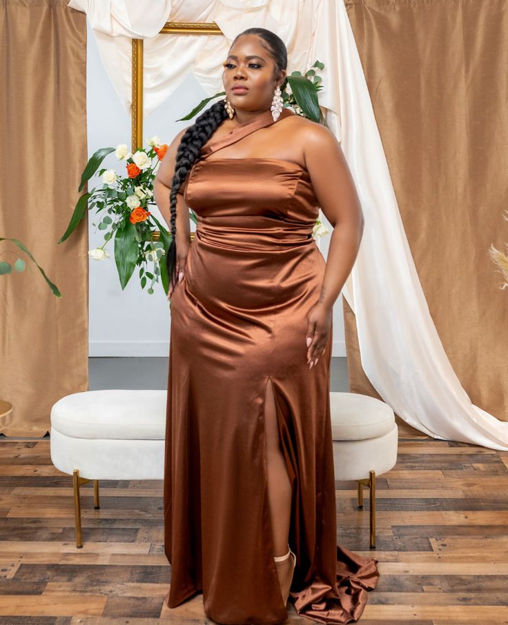 The asymmetrical neckline that crosses your chest and the signature mermaid bottom grazing your curves is the ultimate fit for your bridesmaids. The dress features a split that can be adjusted to be higher or lower at your local tailor. We’ve re-released the Athena Gown for our Signature Collection Capsule in 2022. Available in sizes 4-26 in Luxe (High Shine) Sienna, Mocha, Chocolate, and Champagne. Spring Production will open on February 2, 2022 at 8PM EST! Sign up for product alerts by your sp Cinnamon Bridesmaids Dresses, Brown Wedding Colors, Chocolate Dresses, Chocolate Bridesmaid Dresses, Formal Bridesmaid Dresses, Formal Fits, Athena Dress, Bridesmaids Spring, Brown Bridesmaid Dresses