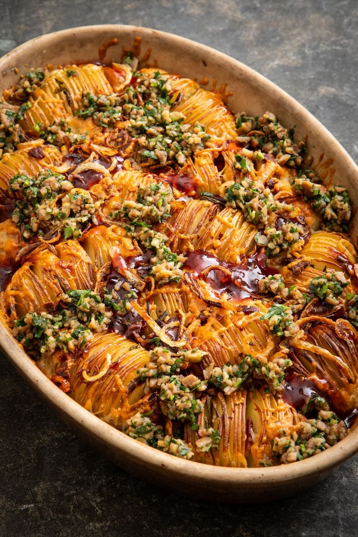 a casserole dish filled with meat and vegetables