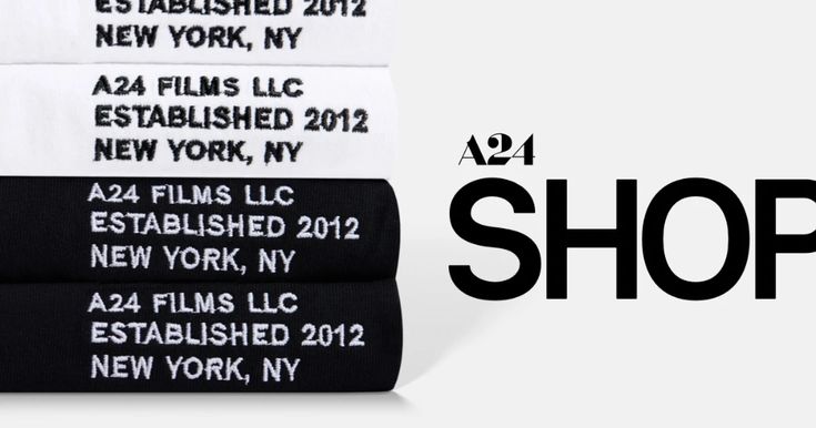 four black and white towels stacked on top of each other with the words shop below them