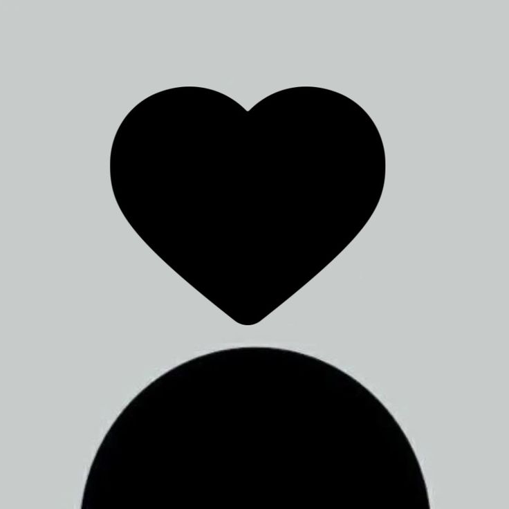 the silhouette of a heart against a gray background