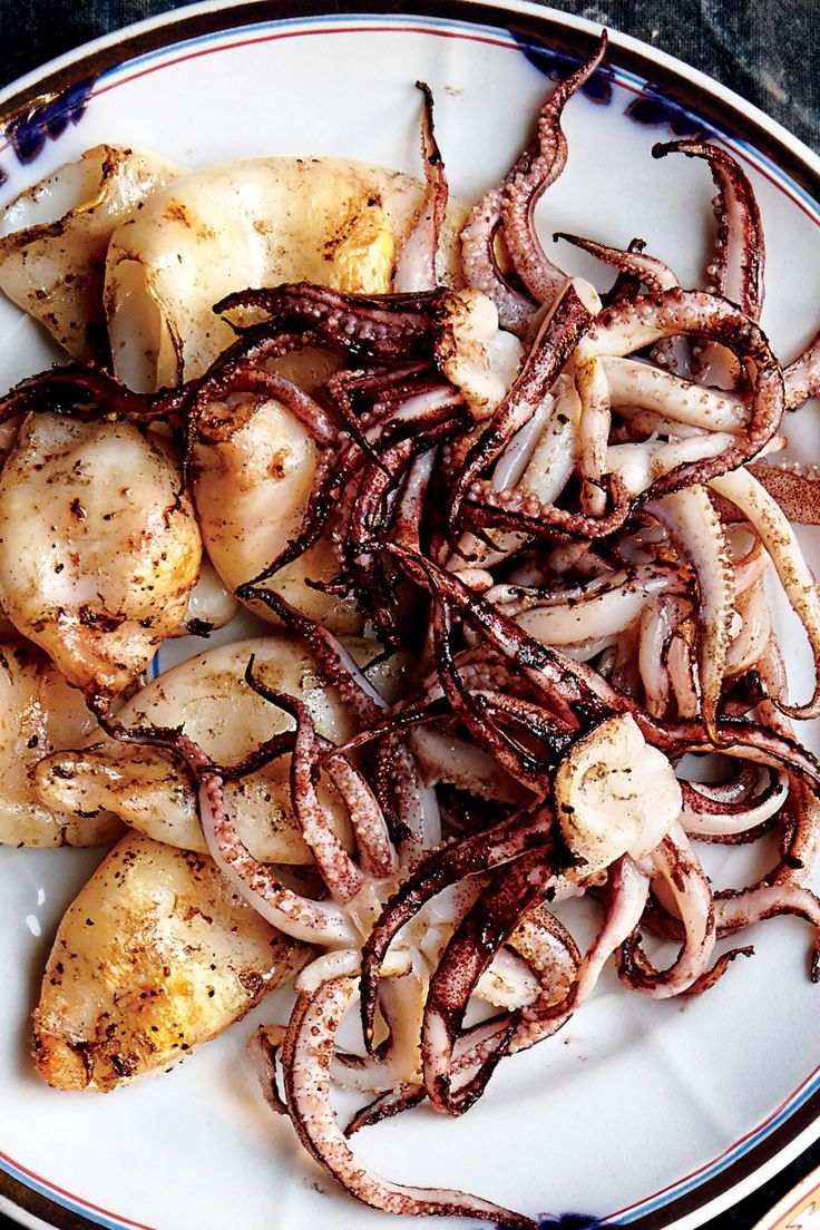 an octopus and potatoes dish on a plate