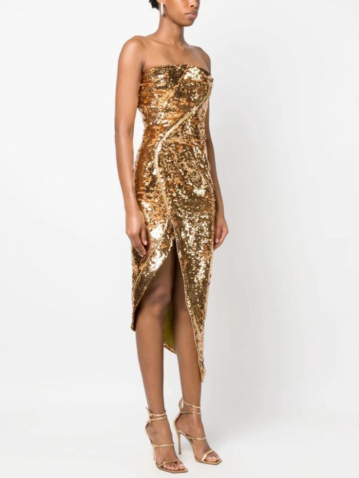 Introducing our stunning Golden Sequin Asymmetrical Cocktail Dress, the epitome of elegance and style. This extraordinary dress is designed to make you feel confident and captivating at any special occasion. Crafted with meticulous attention to detail, this dress boasts a plethora of enticing features that will leave you breathless. The breathable and sustainable polyester fabric ensures comfort without compromising on style. The slight stretch in the material allows for ease of movement, ensuring you can dance the night away with grace and poise. The strapless sleeve style adds a touch of sophistication, accentuating your shoulders and collarbone, while the sheath silhouette complements your natural curves, making you look effortlessly chic. The mid-calf length strikes the perfect balance