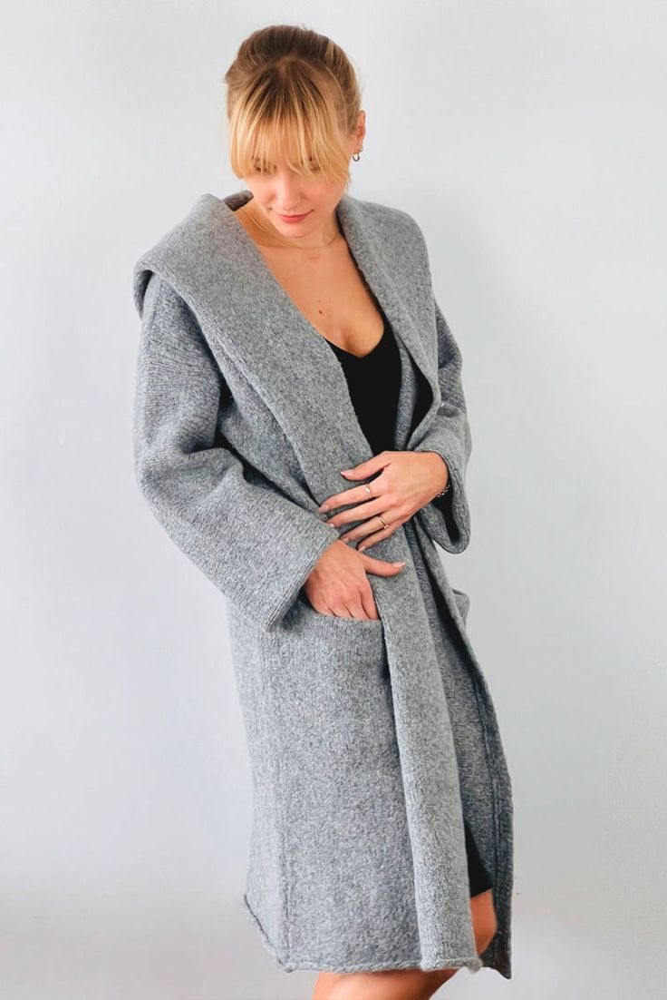 Wrap yourself in the warmth, comfort, and style of the Belen Alpaca Long Hooded Cardigan, a versatile knitwear piece designed to keep you warm and stylish throughout the seasons. Crafted from a luxurious alpaca blend, this cardigan/coat with a hood is elegant and sophisticated, making it perfect for both casual and dressier occasions. - Luxurious Alpaca Blend.- Fashionable and elegant design, the hood adds extra warmth and protection.- Practical pockets.- Versatile length that flatters all body Cozy Sweater Coat For Cold Weather, Cozy Hooded Cashmere Outerwear, Cozy Outerwear For Cold Weather One Size, Cozy One-size Outerwear For Cold Weather, Cozy Soft Knit Outerwear For Cold Weather, Cozy Winter Sweater Coat, Cozy Knit Outerwear For Loungewear, Knit Outerwear With Shawl Collar, Casual Long Wool Coat For Winter