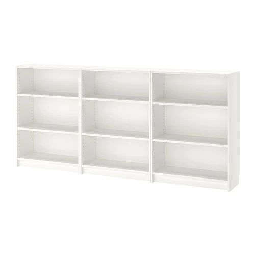 a white bookcase with six shelves on each side