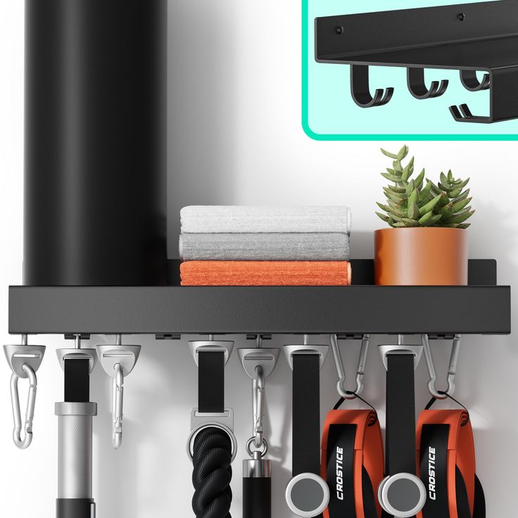 a shelf with several pairs of scissors hanging from it's hooks and two potted plants