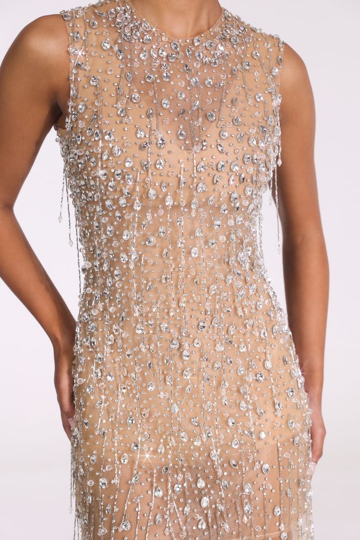 Lee Grebenau Allure line, made-to-order luxury designs, hand-crafted at our atelier for all your glamorous celebrations, including those surrounding your wedding. High neck mini dress. Adorned with crystals and beaded fringes. #leegrebenau #partydress #couturedress #fashion #couturefashion #LPGAllure Luxury Embellished Sleeveless Dress, Elegant Sleeveless Champagne Dress, Elegant Crystal Embellished Mini Dress For Prom, Luxury Crystal-embellished Mini Dress For Formal Occasions, Elegant Party Gown With Illusion Neckline, Glamorous Evening Dress With Illusion Neckline, Glamorous Formal Evening Dress With Illusion Neckline, Formal Embellished Champagne Mini Dress, Elegant Fitted Mini Dress With Illusion Neckline