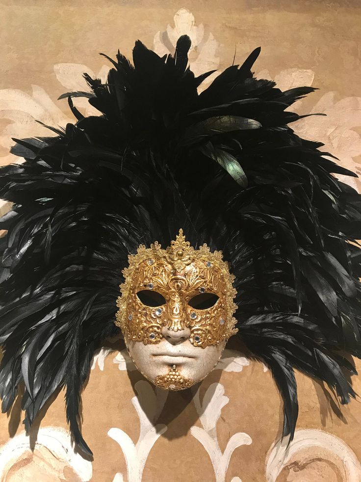 "This masquerade mask for men belongs to our collection of feathers' masks. These masks have a crown of black feathers similar to the one used in the movie of Stanley Kubrick \"Eyes Wide Shut\". It is perfect for any masquerade party, Halloween costume, pro or event in Venice or elsewhere during Carnival. This mask can be gently bent to form to your face and ties in the back with two soft matching ribbons. Size: one-size This kind of mask is also perfect as in interior design element, wall decor Black Full Face Carnival Masks, Black Full Face Masks For Carnival, Black Masks For Carnival Themed Events, Carnival Feather Eye Mask, Black Feathered Masquerade Mask, Carnival Masquerade Masks And Prosthetics With Feathers, Feathered Masks And Prosthetics For Carnival Masquerade, Feathered Masks For Mardi Gras Masquerade, Carnival Feather Mask