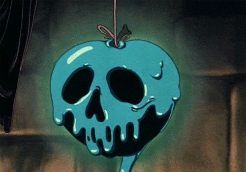 an apple with a skull hanging from it's side