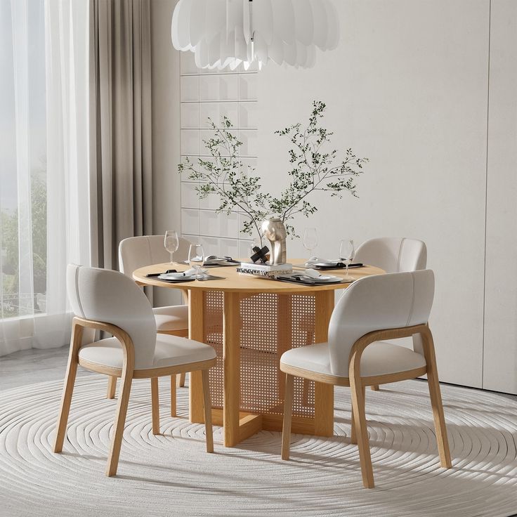 a dining table with four chairs around it